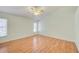 Spacious bedroom featuring a ceiling fan and light-colored walls at 2348 Rolling View Dr, Spring Hill, FL 34606