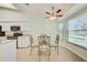 Bright dining area with ceiling fan and natural light from the windows at 2348 Rolling View Dr, Spring Hill, FL 34606