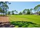 Lush green golf course, perfect for enjoying a round of golf in this beautiful community at 2348 Rolling View Dr, Spring Hill, FL 34606