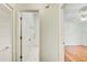 Hallway with a view into a bathroom and a bedroom with vaulted ceiling at 2348 Rolling View Dr, Spring Hill, FL 34606