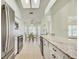 Bright, open kitchen boasts stainless steel appliances, granite countertops, and adjacent dining area at 2348 Rolling View Dr, Spring Hill, FL 34606