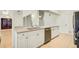 Kitchen view showcasing stainless steel appliances, granite counters, and white cabinetry at 2348 Rolling View Dr, Spring Hill, FL 34606