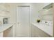 Bright laundry room with modern appliances and ample storage and countertop space at 2348 Rolling View Dr, Spring Hill, FL 34606