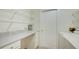 Bright laundry room with modern appliances and ample storage and countertop space at 2348 Rolling View Dr, Spring Hill, FL 34606