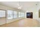 Sunroom with tile flooring, plenty of natural light, and a ceiling fan at 2348 Rolling View Dr, Spring Hill, FL 34606