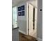 Laundry room with modern appliances and nautical wall decor at 247 Rex Pl # G, Madeira Beach, FL 33708