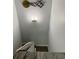 Staircase featuring carpeted steps, granite railing and modern lighting at 247 Rex Pl # G, Madeira Beach, FL 33708