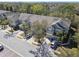 Enjoy this aerial view of a neighborhood showcasing townhouses with lush surroundings, and convenient parking at 2712 Conch Hollow Dr, Brandon, FL 33511