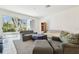 The living room features sliding glass doors to the outdoors, neutral tones, and tile flooring, and great natural light at 2712 Conch Hollow Dr, Brandon, FL 33511