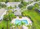 Aerial view of the community pool with palm trees, lounge chairs, and a covered pavilion at 2712 Conch Hollow Dr, Brandon, FL 33511