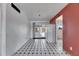 Bright kitchen area with black and white checkered flooring, appliances, and access to the yard at 2903 Florida Blvd, Bradenton, FL 34207