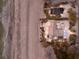 Aerial shot of a beachfront home, revealing a private oasis next to the ocean at 3351 Gulf Of Mexico Dr, Longboat Key, FL 34228