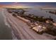 Stunning aerial shot of a coastal community with beach access and ocean views at 3351 Gulf Of Mexico Dr, Longboat Key, FL 34228