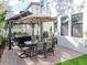 Exterior backyard patio featuring outdoor seating, a gazebo, and artificial turf at 4302 W San Pedro St, Tampa, FL 33629