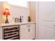 Chic bar area with marble countertop, a wine cooler and a decorative lamp at 4302 W San Pedro St, Tampa, FL 33629