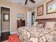 This bedroom has a traditional design, with a large bed, and a doorway leading to another part of the home at 4302 W San Pedro St, Tampa, FL 33629