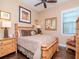 Cozy bedroom featuring a bamboo-style bed frame, ceiling fan and hardwood flooring at 4302 W San Pedro St, Tampa, FL 33629