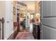 Inviting foyer with dark wood floors and an elegant cabinet, seamlessly transitioning into the living space at 4302 W San Pedro St, Tampa, FL 33629