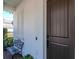 Inviting front porch with a charming bench and detailed wall paneling, creating a cozy entrance at 4302 W San Pedro St, Tampa, FL 33629
