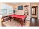 Game room with a billiard table, large windows, and an elegant doorway at 4302 W San Pedro St, Tampa, FL 33629