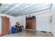 This two car garage includes storage cabinets along the wall, bikes, and overhead lighting at 4302 W San Pedro St, Tampa, FL 33629