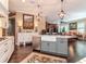 Spacious kitchen featuring a gray island, stainless steel appliances, and open access to the living room at 4302 W San Pedro St, Tampa, FL 33629