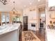 Bright kitchen showcasing white cabinets, marble countertops, stainless steel appliances, and dark hardwood floors at 4302 W San Pedro St, Tampa, FL 33629