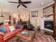 Open-concept living area featuring a fireplace, seamless transition to the kitchen and comfortable seating at 4302 W San Pedro St, Tampa, FL 33629