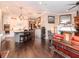 Spacious living room showcasing seamless access to the kitchen, a cozy fireplace and hardwood floors at 4302 W San Pedro St, Tampa, FL 33629