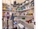 Walk-in pantry features wire shelving for storing food items and small appliances at 4302 W San Pedro St, Tampa, FL 33629