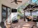 Outdoor patio area with a gazebo, exterior TV, dining and sitting areas, and a manicured lawn at 4302 W San Pedro St, Tampa, FL 33629