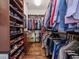 Large walk-in closet with extensive shelving, hardwood floors, and ample storage space at 4302 W San Pedro St, Tampa, FL 33629