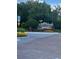 Inviting community entrance sign with manicured landscaping and American flag display at 4321 Winding River Way, Land O Lakes, FL 34639
