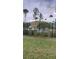 Exterior view of a well-maintained community pool area with lush greenery and privacy fencing at 4321 Winding River Way, Land O Lakes, FL 34639