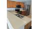 Spacious kitchen featuring stainless steel appliances and a double sink at 4321 Winding River Way, Land O Lakes, FL 34639