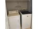 Functional laundry area with modern washer and dryer, and laundry-themed decor at 4321 Winding River Way, Land O Lakes, FL 34639