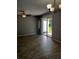 Spacious living room with gray walls, modern flooring, and backyard access at 4321 Winding River Way, Land O Lakes, FL 34639