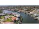 Waterfront home with pool and boat lift, offering easy access to Gulf waters, with skyline in the distance at 4901 Lansing St Ne, St Petersburg, FL 33703