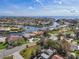 Waterfront community with expansive canals, mature trees, and residences with distinct roof lines, near open water at 4901 Lansing St Ne, St Petersburg, FL 33703