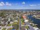 An aerial view of a neighborhood with a long road leading to waterfront homes at 4901 Lansing St Ne, St Petersburg, FL 33703