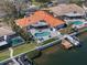 Waterfront property with a private boat dock and stunning pool area provides the perfect spot for relaxation at 4901 Lansing St Ne, St Petersburg, FL 33703