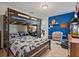 This bedroom boasts a bunk bed, colorful accents, and a cozy chair for relaxation at 4901 Lansing St Ne, St Petersburg, FL 33703