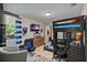 This bedroom features a bunk bed, TV, gaming chair, natural light and playful decor at 4901 Lansing St Ne, St Petersburg, FL 33703