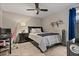 Cozy bedroom featuring a modern bed frame, an attractive nightstand, and stylish decor at 4901 Lansing St Ne, St Petersburg, FL 33703