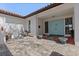 Inviting front entrance with light blue double doors, tiled courtyard and quaint fountain at 4901 Lansing St Ne, St Petersburg, FL 33703