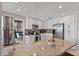 Open kitchen featuring granite countertops, stainless steel appliances, and seamless flow at 4901 Lansing St Ne, St Petersburg, FL 33703