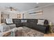 Cozy living room showcasing a sectional sofa, patterned rug, and stylish decor at 4901 Lansing St Ne, St Petersburg, FL 33703