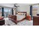 The primary bedroom features a wood sleigh bed, access to outdoor patio and neutral wall color at 4901 Lansing St Ne, St Petersburg, FL 33703