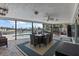 This enclosed patio features an outdoor dining area, pool, and waterfront views at 4901 Lansing St Ne, St Petersburg, FL 33703