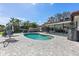Backyard featuring a kidney shaped pool with patio furniture and waterfront access at 4901 Lansing St Ne, St Petersburg, FL 33703